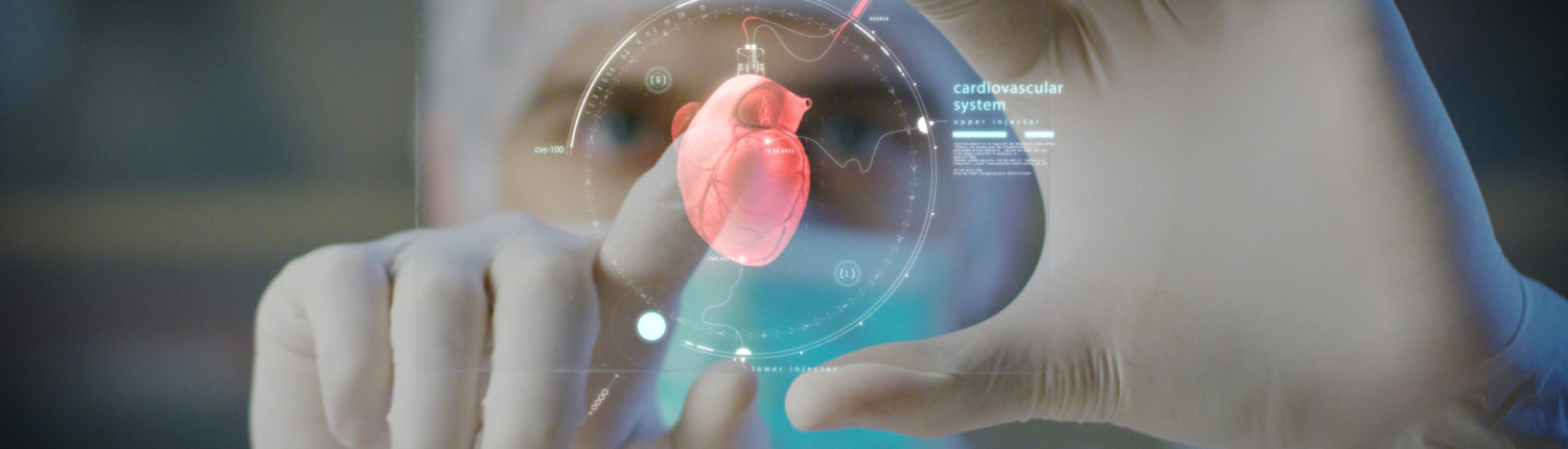 doctor with plastic gloves points on the screen the image of a heart